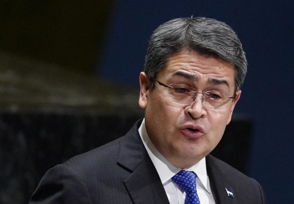 Portrait of a bespectacled man with gray hair in a dark suit and blue tie, reflecting seriousness, associated with recent headlines about Juan Orlando Hernández, Tony Hernández, and Alexander Ardón