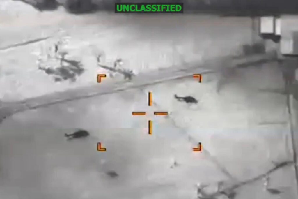 Night-vision view of a street with crosshair marks overlay and distant figures, labeled UNCLASSIFIED, featuring Ecuador and Estados Unidos security context and SOUTHCOM reference.